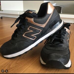 New Balance 574 Black and Metallic Sneakers barely worm.
